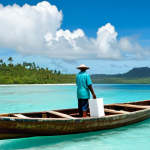A determined Solomon Islands election official, fully clothed in a professional, modest light uniform, carefully transporting ballot boxes by a traditional wooden boat across calm turquoise waters between small, lush tropical islands. The sky is clear, with a few white clouds, symbolizing the efforts to ensure democratic access in challenging geographical settings. The official has perfect anatomy, correct proportions, and a natural pose. Well-formed hands, proper finger count, and natural body proportions are visible. Safe for work, appropriate content, family-friendly, professional photography, high quality.